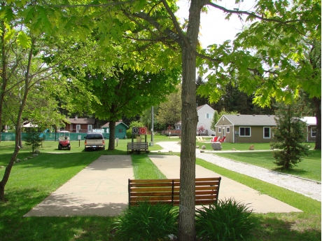 Shuffleboard Courts with Bunk Cottage and pool in background